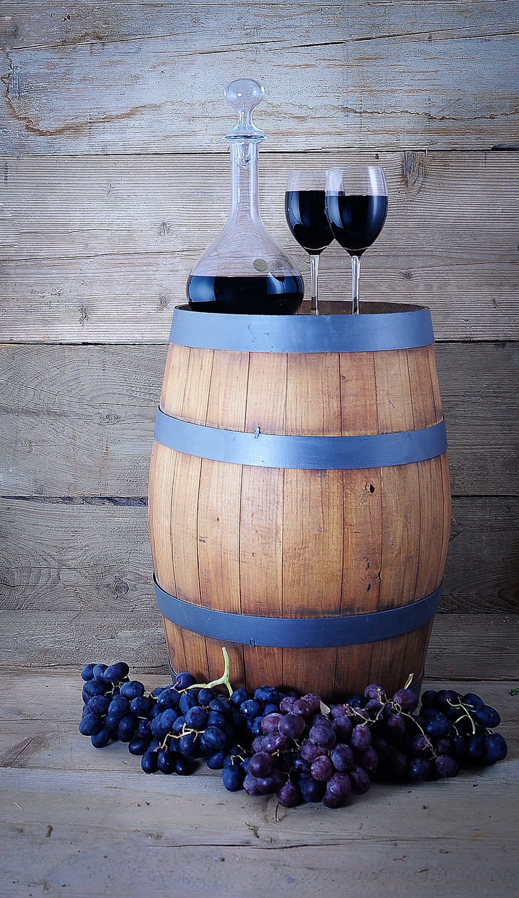 Wine barrel with grapes and glasses